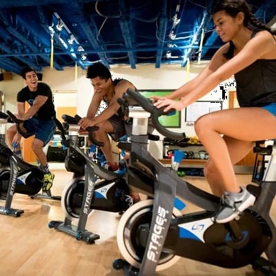 Members riding together in the cycling studio