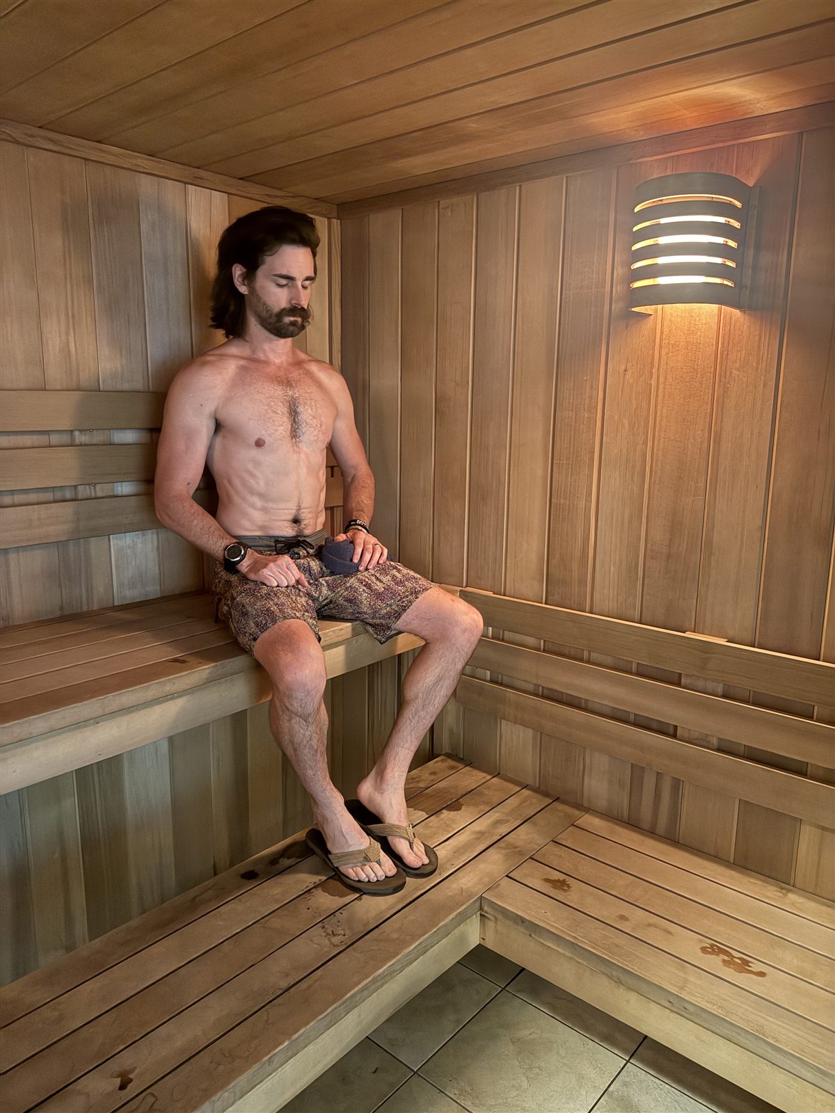 A member relaxing in the cedar sauna at ONE Boulder Fitness